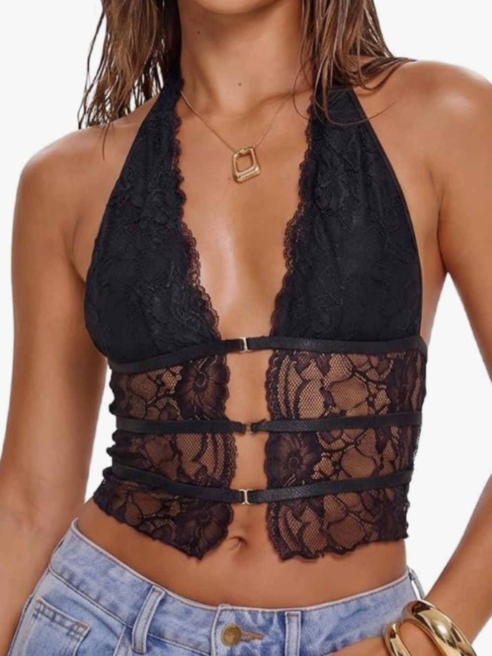 A sultry black lace halter crop top with three decorative front straps. Soft lac